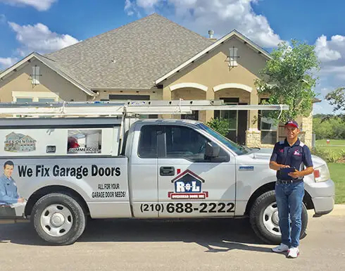 RL Garage Door Repair technician beside service van